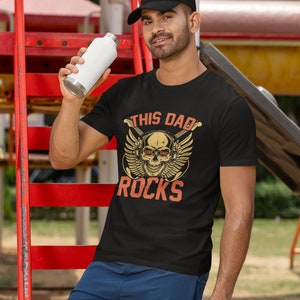 This dad rocks Unisex Softstyle T-Shirt
