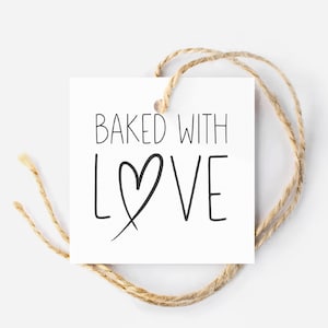 May include: White gift tag with black text that reads "Baked with Love" and a hand-drawn heart.