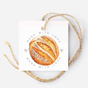 May include: White gift tag with a brown and white loaf of bread illustration and the text "Made with Love" repeated twice.
