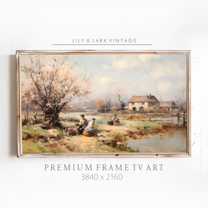Puede incluir: Una pintura vintage en un marco blanco representa una escena rural con un río, una casa y tres figuras de pie cerca de un árbol. El cielo es azul con nubes blancas. La pintura se titula "Premium Frame TV Art 3840 x 2160".