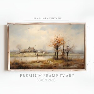 Puede incluir: Una pintura vintage de un paisaje rural con una granja, árboles y un río. La pintura está enmarcada en un marco de madera blanco. El texto "LILY & LARK VINTAGE" está en la parte superior de la imagen. El texto "PREMIUM FRAME TV ART 3840 x 2160" está en la parte inferior de la imagen.