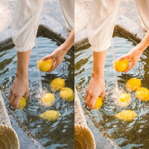 May include: A person washes lemons in a stone basin filled with water. The lemons are yellow and the water is clear.