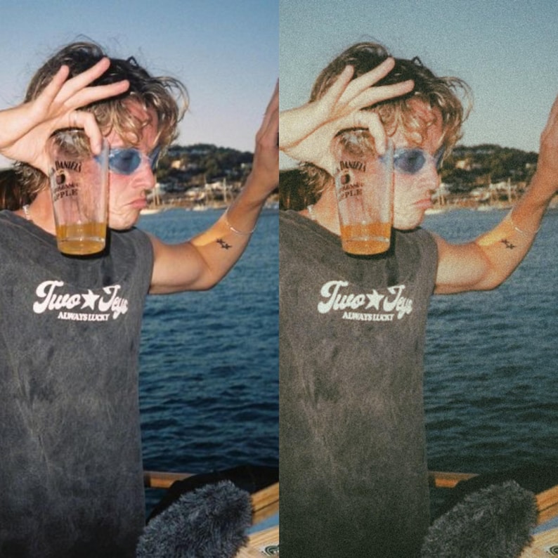 K&ouml;nnte beinhalten: Eine Person tr&auml;gt ein graues &auml;rmelloses Shirt mit dem Text "Two Jay's Always Lucky" und h&auml;lt ein Glas mit bernsteinfarbener Fl&uuml;ssigkeit. Die Person tr&auml;gt eine Sonnenbrille und steht vor einem Gew&auml;sser.