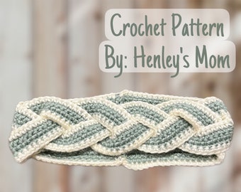 May include: A crocheted headband with a braided design in shades of sage green and white. The headband is made with a simple stitch and has a subtle texture. Crochet Pattern By: Henley's Mom
