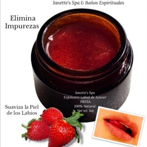 May include: A glass jar of red strawberry sugar lip scrub with the text "Exfoliante Labial Natural" and "Janette's Spa & Baños Espirituales". The jar is labeled "Exfoliante Labial de Azúcar FRESA 100% Natural Net wt. 1oz".