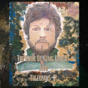 Op de afbeelding: Een kleurrijke albumhoes met een portret van een man met een baard en krullend haar. De tekst op de hoes luidt "The Book of King Ramses and Tigerpaws".