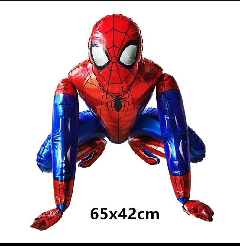 May include: A large, red and blue Spider-Man balloon in a crouching pose. The balloon features the character's iconic mask with white eye shapes and a black spider emblem on the chest. The balloon measures 65cm x 42cm.