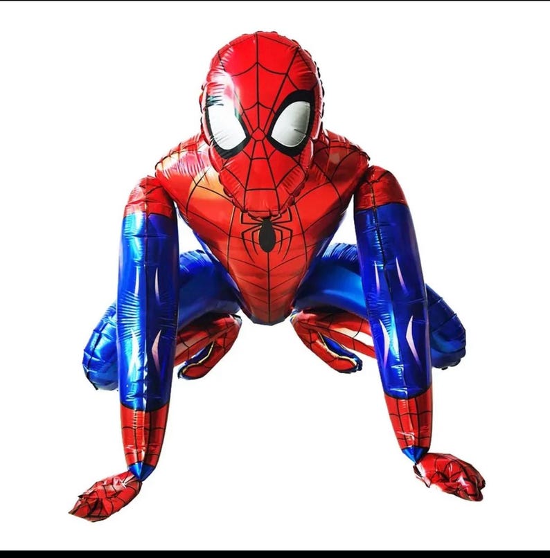 May include: A large, red and blue Spider-Man foil balloon in a crouching pose. The balloon features the character's iconic mask with white eyes and a black spider emblem on the chest. The legs and arms are blue.