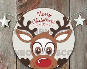 May include: A round, white, wooden sign with a brown reindeer face and the text "Merry Christmas" in red.