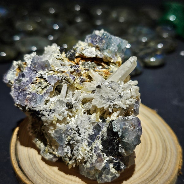 Green/ purple fluorite with quartz and calcite with a small section or pyrite.