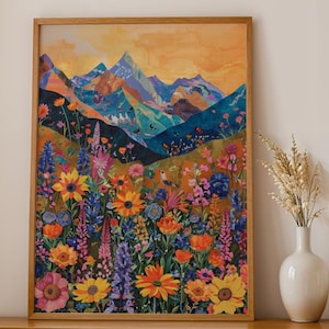 Puede incluir: Una impresión de arte de collage colorido que presenta una cordillera con un campo de flores silvestres en primer plano. Las montañas están pintadas en tonos de azul, verde y morado, mientras que las flores silvestres son una mezcla de rosa, amarillo, naranja y rojo. Un pequeño pájaro está posado en una rama en el centro de la impresión.