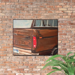 May include: A brown painting of the rear of a vintage Ford pickup truck. The truck features a red taillight, a chrome bumper, and a license plate. The word "FORD" is visible on the tailgate. The artwork is framed in black.