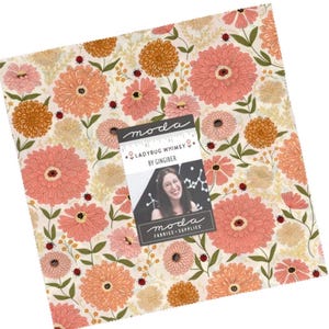 May include: A square stack of fabric featuring a floral pattern with pink and orange flowers, green stems, and small red ladybugs on a cream background. A paper label reads: moda, LADYBUG WHIMSY BY GINGIBER, moda FABRICS + SUPPLIES.