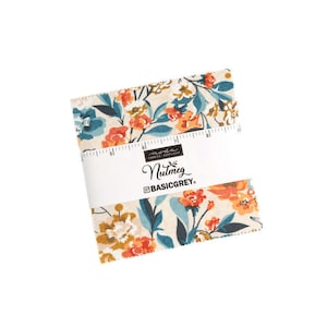 May include: A bundle of fabric squares featuring a floral design in orange, teal, and cream hues. The fabric is wrapped with a white band displaying "Nutmeg" and "BASICGREY." The fabric squares have a ruler printed on them.