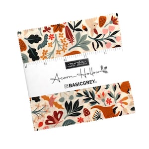 May include: Fabric squares with a cream backdrop, featuring a pattern of leaves, flowers, and woodland creatures in orange, green, and brown. The label reads "Acorn Hollow" by BASICGREY.