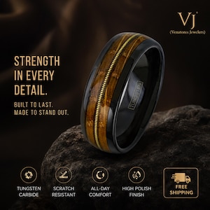 May include: A black tungsten carbide ring with a wood grain inlay and a gold-colored center stripe. The ring is scratch-resistant and has a high-polish finish. Text on the image reads "Strength in Every Detail."