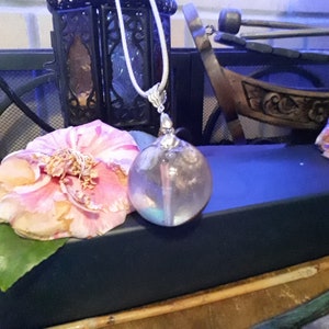 Metal stork bird skull with shells,   turquoise stones in resin globe