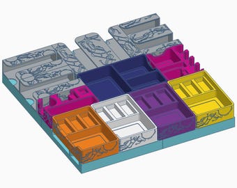 May include: A multi-colored board game organizer with various compartments in shades of gray, blue, pink, orange, white, purple, and yellow. The organizer has a light blue base and features a circuit board design. It is designed to hold game components.