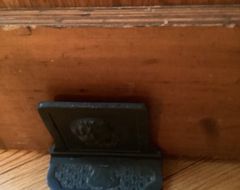 Vintage cast iron Lincoln door stop