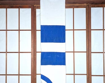 May include: A rectangular, vertically-oriented textile with a white background and blue stripes. The top portion is white, followed by a blue stripe, a white stripe, another blue stripe, and a white section with a blue curved design.