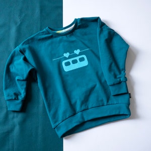 Sweater Herzibahn / aus BioSweat für Kinder / Sofortkauf Gr.104 petrol/aqua
