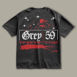 May include: Black t-shirt with a white graphic design of a rose with petals falling, a white banner with the text "Grey 59" and white stars. The graphic is surrounded by red dripping paint.