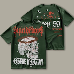 May include: Two green t-shirts with a skull and crown of thorns design on the front and the text "Suicideboys Grey Day 2022" and the text "Grey 59" on the back.