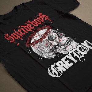 May include: Black t-shirt with a white skull wearing a crown of thorns with red blood dripping down. The text "Suicideboys" is in red and "Greyday" is in white.
