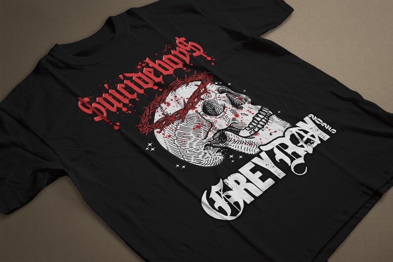 May include: Black t-shirt with a white skull wearing a crown of thorns with red blood dripping down. The text "Suicideboys" is in red and "Greyday" is in white.