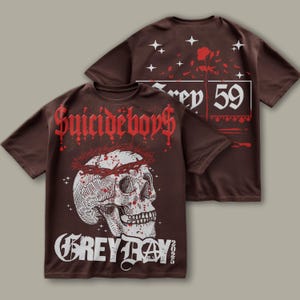 May include: Brown t-shirt with a skull graphic and the text "Suicideboys Grey Day 2025". The back of the shirt has a rose and the text "Grey 59".