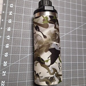 May include: A stainless steel water bottle with a black lid and a camouflage pattern sleeve. The sleeve has a white, green, and brown camouflage pattern.