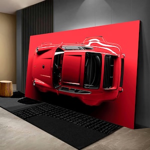 May include: A red sports car is flipped upside down against a red background. The car is a classic model with a black interior and a white stripe on the side.