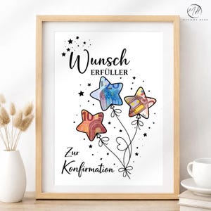 May include: A framed print with the text "Wunsch Erfüller" and "Zur Konfirmation". The artwork features star-shaped balloons with currency designs, set against a white background, and framed in light wood.