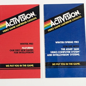 May include: Two blue and red paper catalogs for Activision video game cartridges. The red catalog is for Winter 1982 and features the first new games for Intellivision. The blue catalog is for Winter/Spring 1983 and is for use with the Atari 2600 video computer system and Intellivision systems. Both catalogs have the text "We put you in the game."