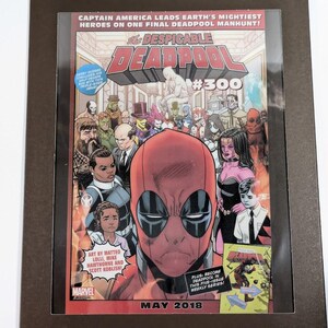 May include: A comic book cover featuring Deadpool in a red and black suit with a red mask. The cover is titled "The Despicable Deadpool #300" and features a group of superheroes in the background. The cover is set against a red and white background with the text "May 2018" at the bottom.