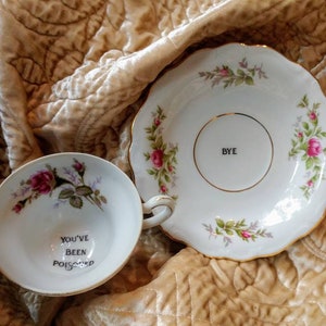 You&#39;ve been poisoned bye tea cup and saucer altered china teacup gift custom pink rose personalized poison cup message at bottom Murderino