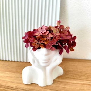 Face with dried flowers