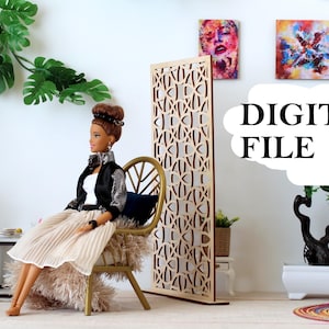 May include: A doll with brown hair in a bun, wearing a black and silver jacket and a beige pleated skirt, sits on a gold chair next to a tall, light-colored wooden room divider with a geometric cutout pattern. The text DIGITAL FILE is visible.