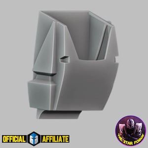 May include: A gray plastic model of a robot head, with a sharp, angular design. The model is designed to be used as a miniature for tabletop games.
