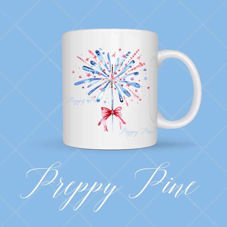 May include: White ceramic mug with a watercolor design of a red, white, and blue firework with a red bow. The mug has the text "Preppy Pine" on the bottom.