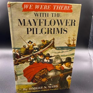 May include: A vintage book titled "We Were There With The Mayflower Pilgrims" with a colorful illustration of pilgrims in a boat and a ship. The book cover has a red banner with white text and the author's name.