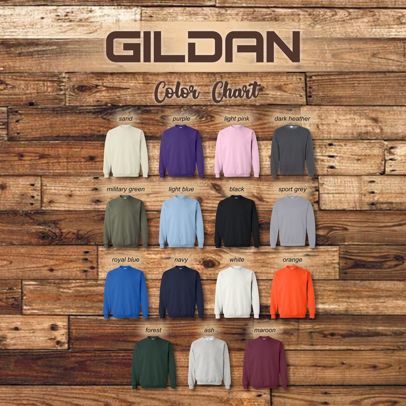 May include: Color chart for Gildan sweatshirts showing 15 different colors: sand, purple, light pink, dark heather, military green, light blue, black, sport grey, royal blue, navy, white, orange, forest, ash, and maroon.
