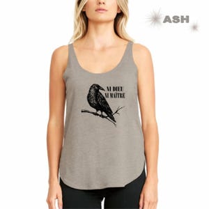 May include: A gray tank top with a black crow illustration and the text "NI DIEU NI MA&Icirc;TRE" printed on the front.