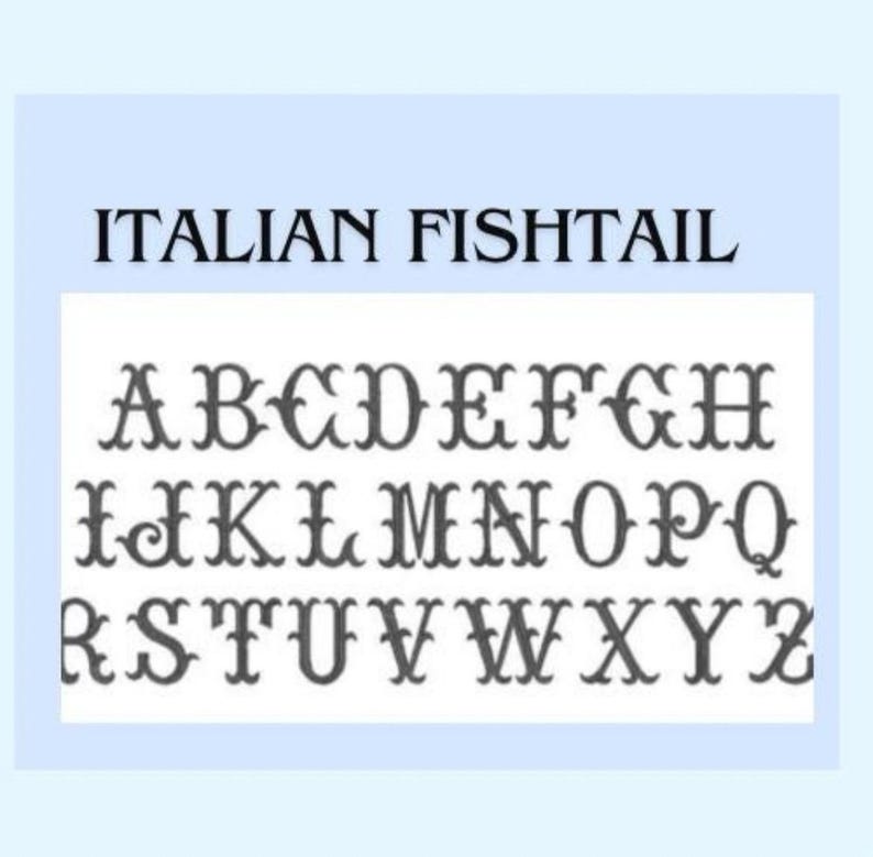 May include: A digital display of the alphabet in the Italian Fishtail font style. The letters A through Z are presented in three rows in a dark grey colour against a white background. The text ITALIAN FISHTAIL is printed in black at the top.