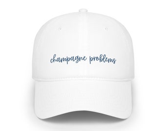 Champagner-Probleme-Baseballkappe mit niedrigem Profil. Perfekter Swiftie-Merch, um zurückhaltende Taylor-Lyric-Champagner-Probleme zu rocken