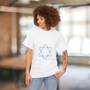 May include: A white t-shirt with a blue design of a hexagon made of binary code.