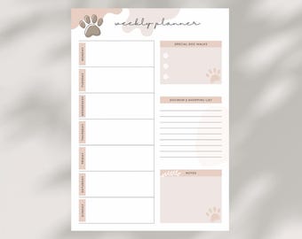 May include: A weekly planner with a paw print design. The planner has sections for each day of the week, as well as sections for special dog walks, dog mom's shopping list, and notes. The planner is designed for dog moms.