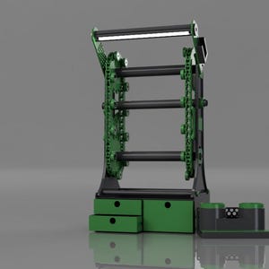 Può includere: Un rack di stoccaggio in metallo verde e nero con tre barre scorrevoli e due cassetti. Il rack ha un'illuminazione in cima.