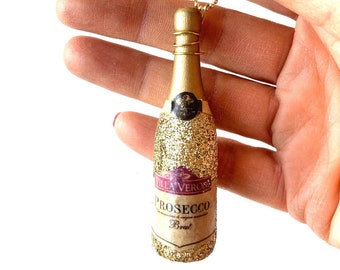 Sautoir La p'tite bouteille de PROSECCO GLITTER bouteille miniature dorée pailletée par The Sausage