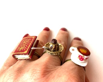 Ring ONE FINE TEA triplet ring with tea chocolate cake and good book Miniature scene by The Sausage